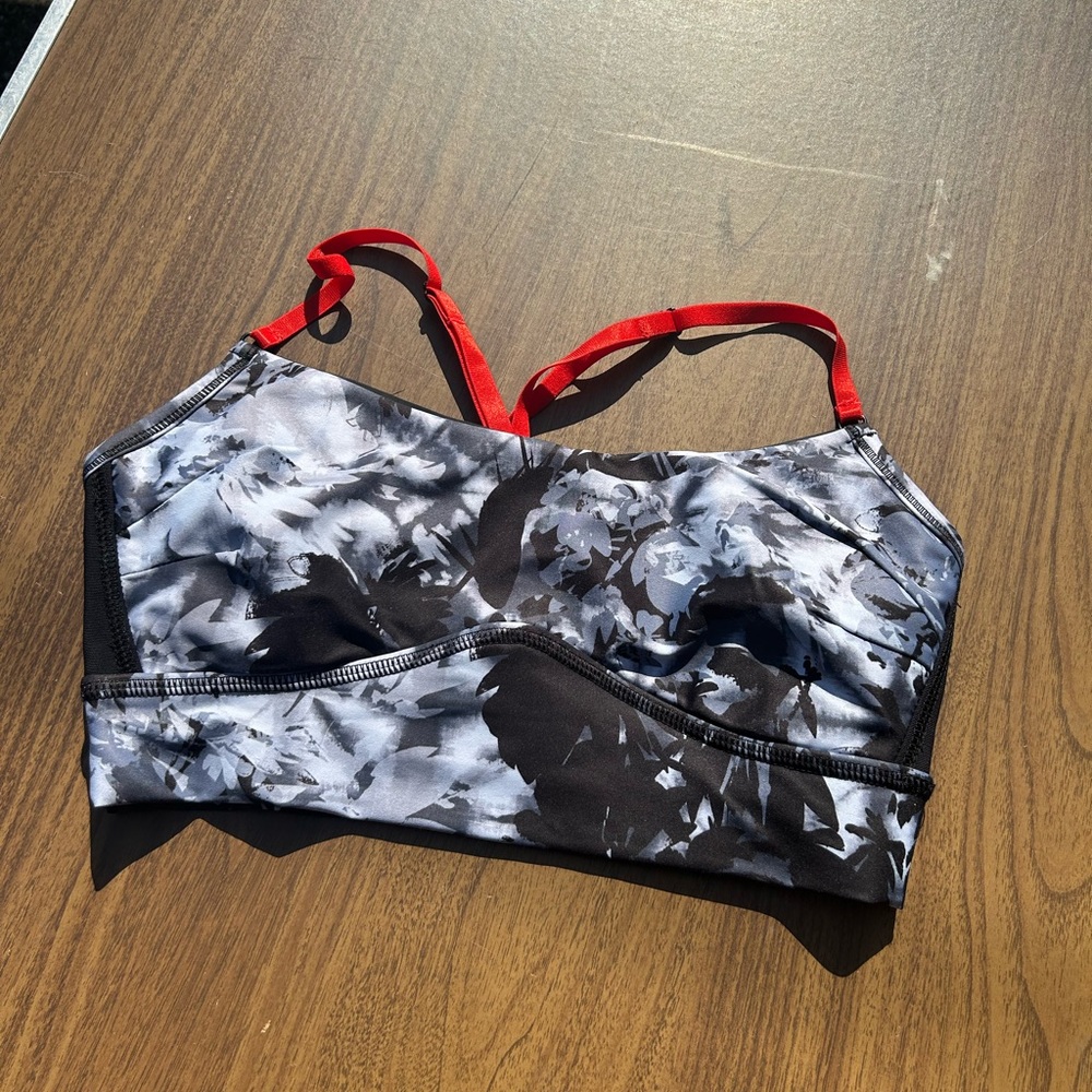 Alala print sports bra with red adjustable straps